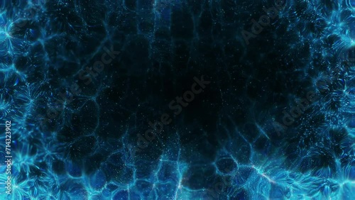 Abstract motion background shining colorful particles. Seamless 4K loop video.