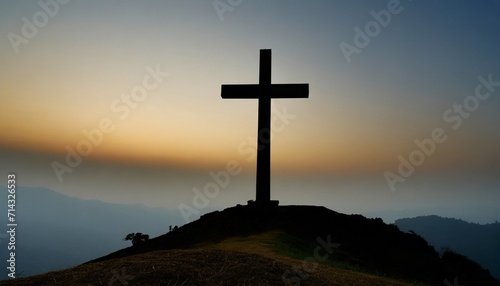 the silhouette of the cross a symbol of god s love for people a large christian cross on a hill