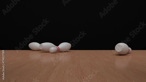 The bowling ball travels down the bowling alley, hits and knocks down the bowling pins. Bowling strike. Concept of achieve goals and win. photo