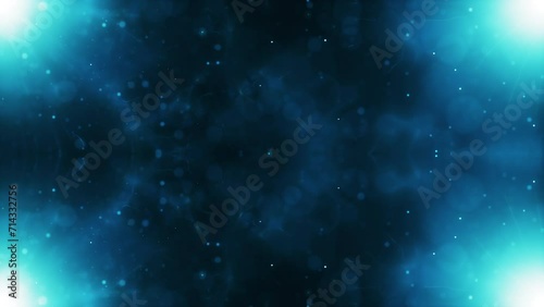 Abstract motion background shining colorful particles. Seamless 4K loop video.