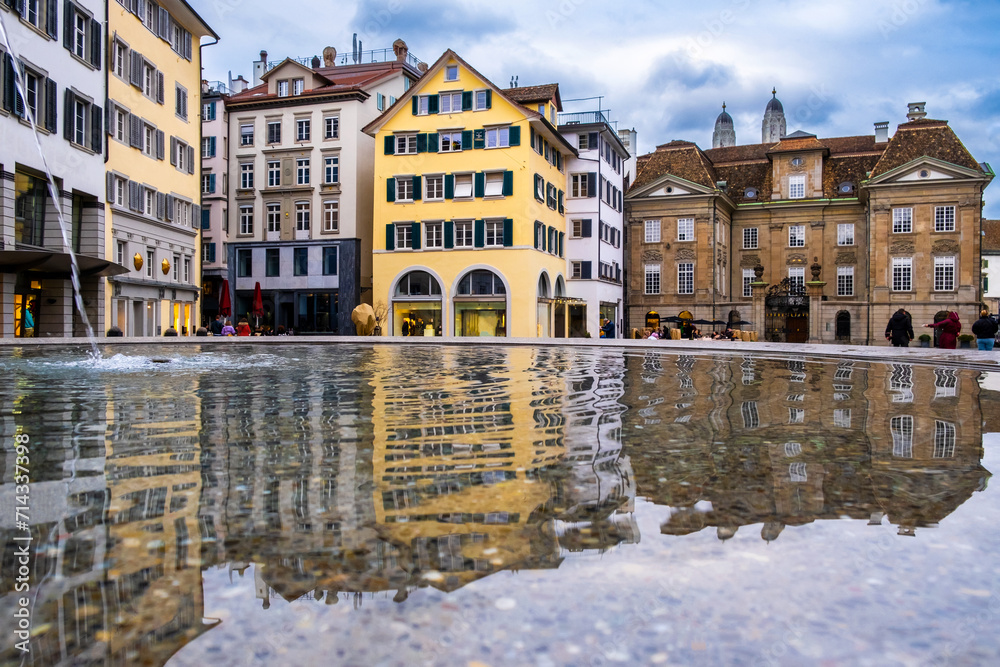 Zurich city center, Switzerland. Zuerich old town with famous Munsterhof fountain and historic houses in winter