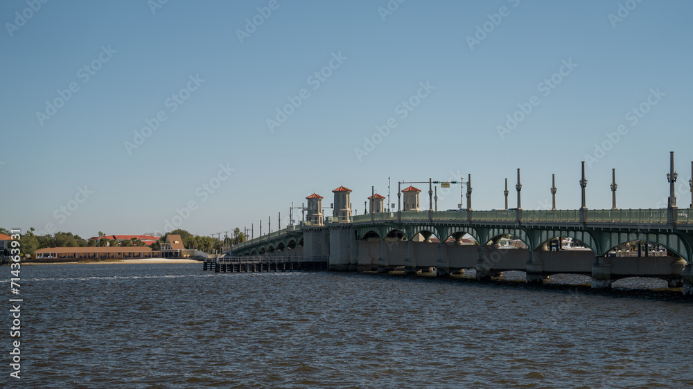 The Bridge of Lions spans a river in Saint Augustine, Florida, on a clear winter day.