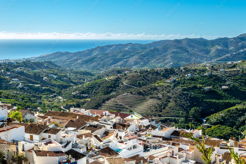 View of the white city and mountains. Panorama of the city of Frigiliana, Spain.