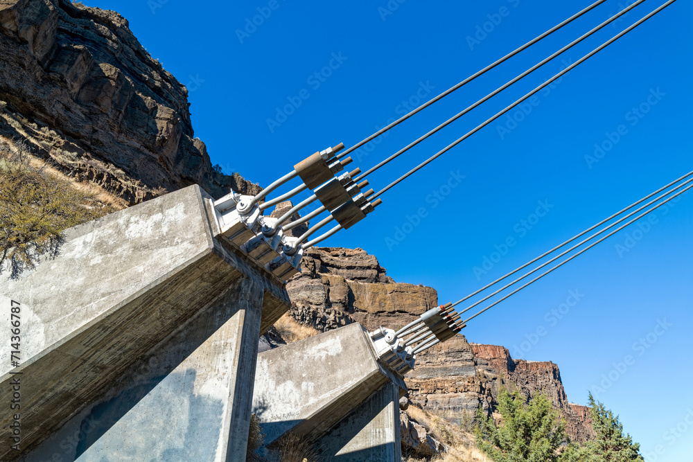 Concrete anchors for the cables supporting the bridge over the Deschutes River at Cove Palisades State Park, Oregon, USA Concrete anchors for the cables supporting the bridge over the Deschutes River at Cove Palisades State Park, Oregon, USA