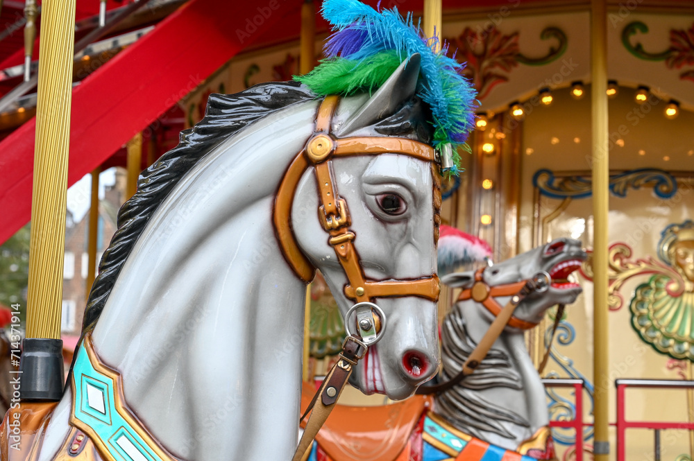 Horse carousel ride. Carnival Ride. A horse in an amusement park for children. Horse on the merry-go-round. Entertainment for youth.