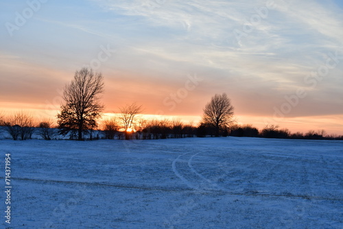 Sunset Over a Snowy Field