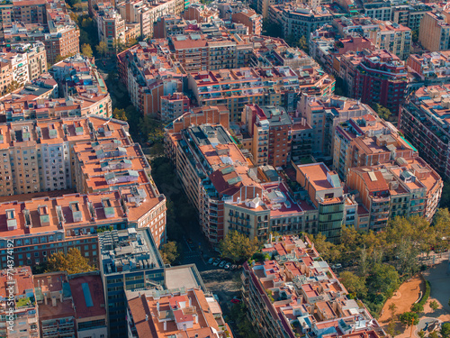 Aerial view of Barcelona City Skyline and Sagrada Familia Cathedral at sunset. Residential famous urban grid of Catalonia. Beautiful panorama of Barcelona.