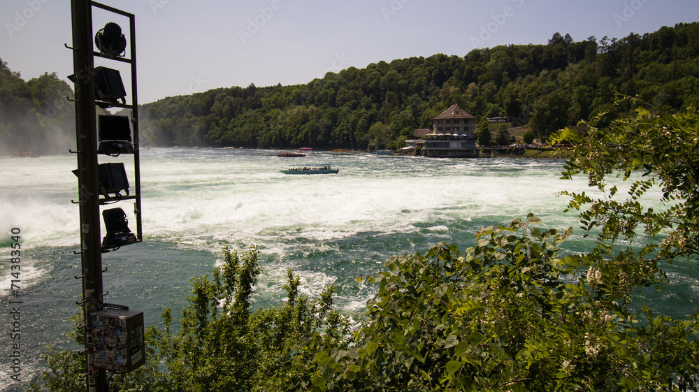 Stunning Daytime View of the Rushing Waters at Rhine Falls, Switzerland
