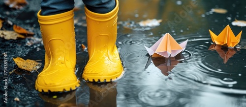 A photo symbolizing the concept of spring shows a child in yellow rubber boots enjoying puddles and paper boats, alongside images of spring and autumn holidays.