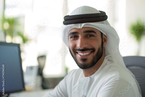 smiling emirati arab at office wearing kandura © senyumanmu