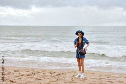 Carefree Summer Portrait: a Pretty Young Lady Enjoying Leisure on a Sunny Beach