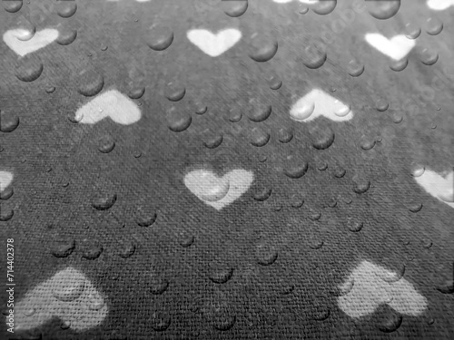 hearts affect image. geometric seamless water drop pattern, with black background scattered shapes in love concept.