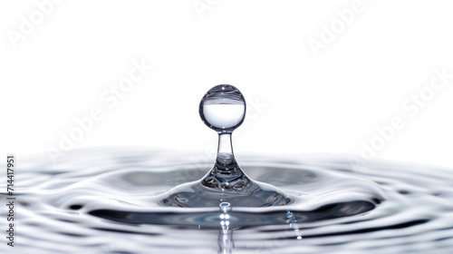  a drop of water falling into a pool of water with a drop of water in the middle of the drop and a drop of water in the middle of the pool.