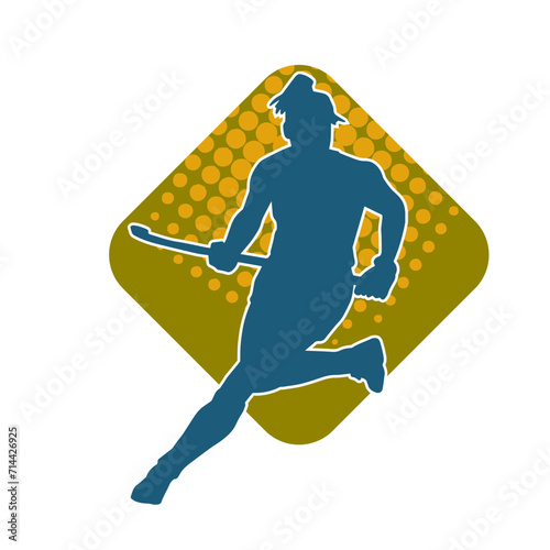 Silhouette of female field hockey athlete in action. Silhouette of a woman playing field hockey sport.