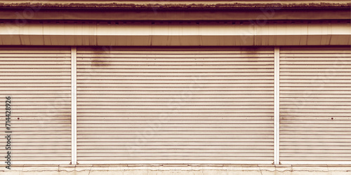 Rusty steel shutter door of warehouse, storage or storefront for metal door background and textured.