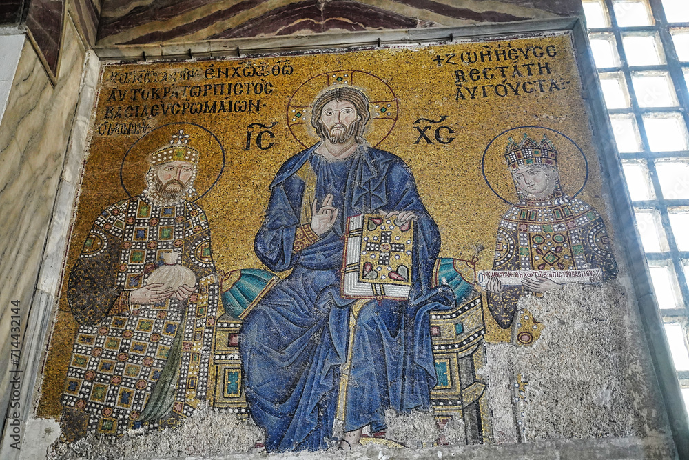 Byzantine mosaic of Jesus Christ sitting on throne with Empress Zoe and Emperor Constantine IX Monomachus in Hagia Sophia, UNESCO world heritage church and mosque in Istanbul, Turkey