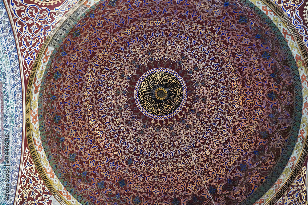 Elaborately decorated motifs and artwork on the dome of the audience chamber hall in the Topkapi palace harem in Istanbul, Turkey