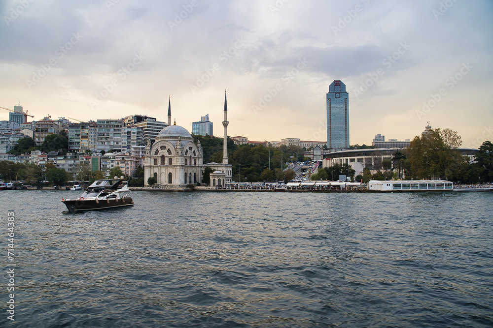 Dolmabahce Mosque and Suzer Plaza in Kabatas area seen from bosporus cruise in Istanbul,Turkey