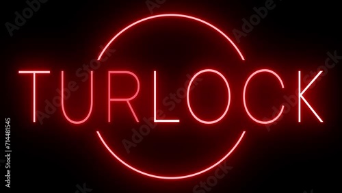 Flickering red retro style neon sign glowing against a black background for TURLOCK photo