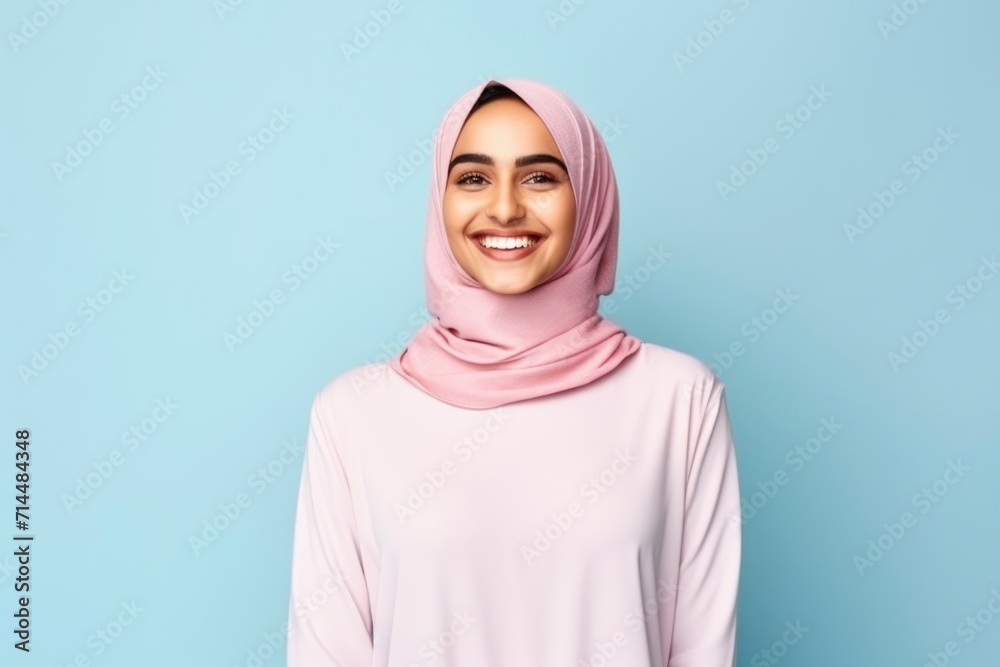 Photo of a beautiful young muslim woman smiling Photo of a beautiful young muslim woman smiling