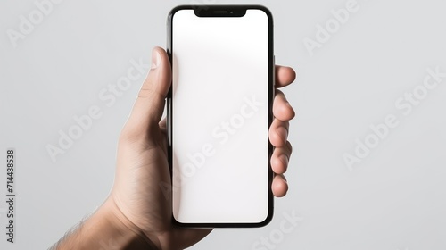 man hand holding smartphone with blank screen on white background, smart phone mockup photo
