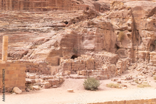 The side part of the well preserved amphitheater carved by Nabatean craftsmen into rock in the Nabatean Kingdom of Petra in the Wadi Musa city in Jordan