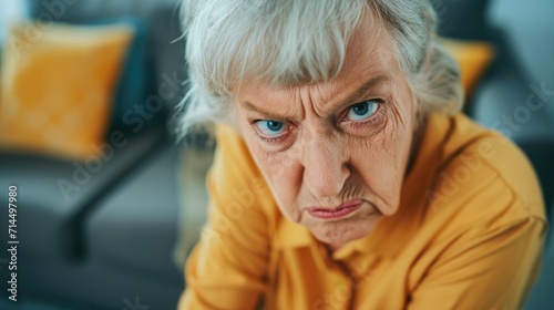 Angry belligerent senior woman looking at the camera