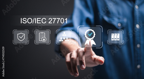 ISO/IEC 27701 concept, businessman touch virtual screen of ISO/IEC 27701 icon for privacy information management system - PIMS and cyber security.