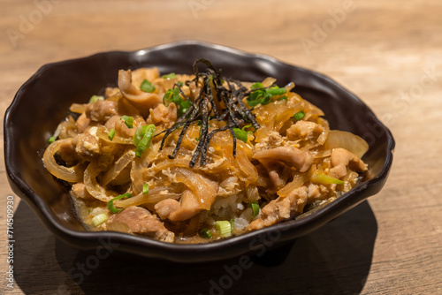 Close-up view of the Japanese cuisine Donburi chicken rice with egg ,seaweed and onion.