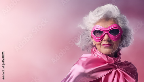 Old woman with gray hair wearing glasses and raincoat super hero