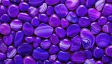 A lot of smooth purple agate stones background 