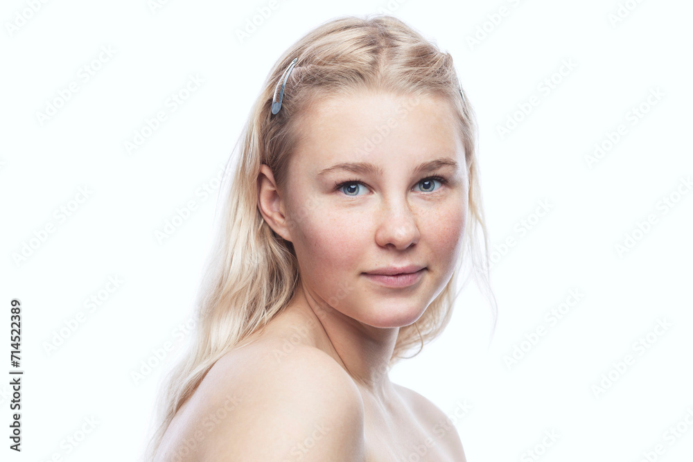 Tender teenage girl with freckles. Smiling pretty blonde girl. Isolated on a white background. Naturalness, youth and tenderness. Close-up. Tender teenage girl with freckles. Smiling pretty blonde girl. Isolated on a white background. Naturalness, youth and tenderness. Close-up.