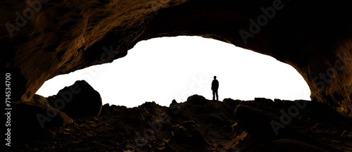 Adventure Man Hiker standing in Rocky Cave on top of a Mountain, Looking out. PNG Cutout. 3d Rendering