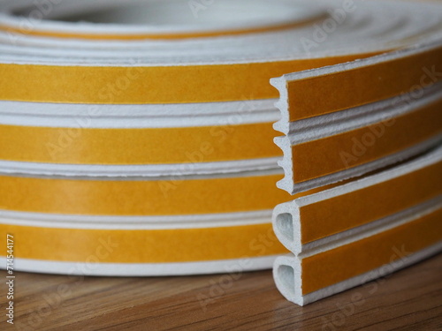Door and window rubber seal strip. Various types of self-adhesive rubber gasket. Sealing tape for windows and doors in a roll. Rubber sealant for windows and doors