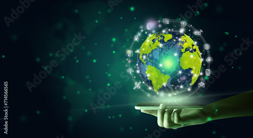 Businessman holding a mobile which projecting the global connection with communication equipments orbit around the world. New global business connection concept. Copy space.