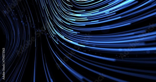Descending and expanding stream of moving blue lines from dots on a black background. Flying blue particles. Abstract animation. photo