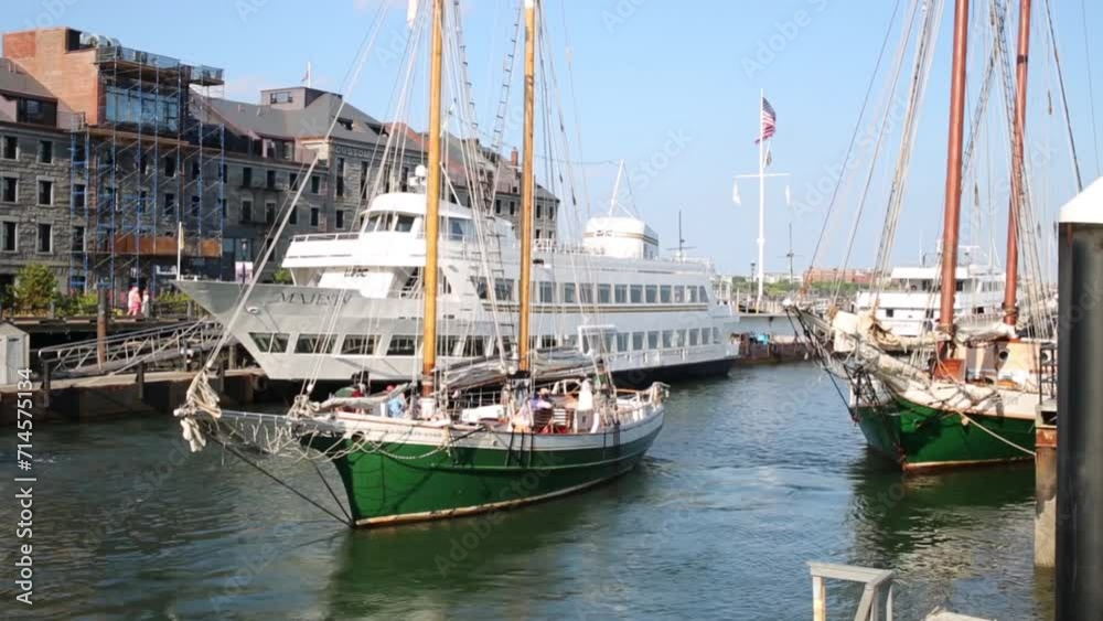 Sailing ship leaves harbor in Boston, United States. Sailing ship leaves harbor in Boston, United States.