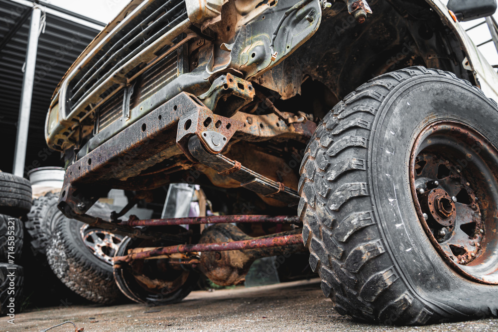 Rusty abandoned car at a big car scrapyard Rusty abandoned car at a big car scrapyard