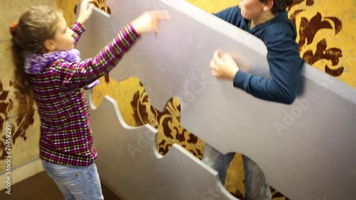 Two children play with large blade in Giant house on Arbat 16