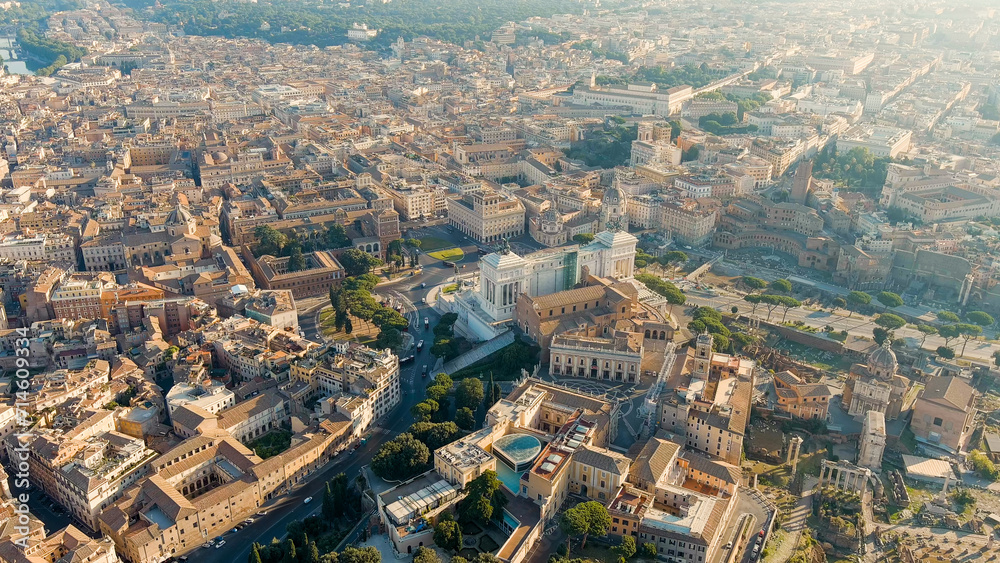 Rome, Italy. Vittoriano - Monument to the first king of Italy, Victor Emmanuel II. Flight over the city. Panorama of the city in the morning. Backlight. Summer, Aerial View