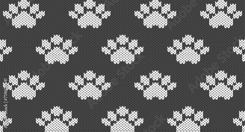 White animal paw prints on grey knitted pattern, Festive Sweater Design. Seamless Knitted Pattern