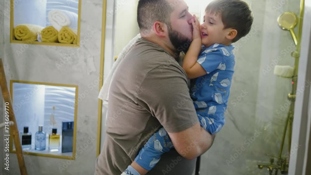 Happy father playing with his little son in the bathroom Happy father playing with his little son in the bathroom