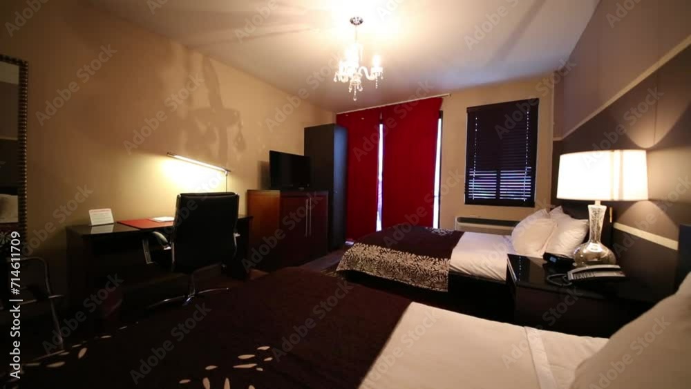 Turn on/off in bedroom with two beds and lamps in hotel