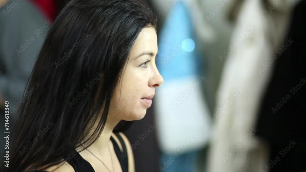 Black-haired smiling model head in profile at visagiste. Black-haired smiling model head in profile at visagiste.