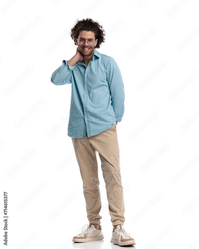 handsome young man wearing sunglasses holding his face handsome young man wearing sunglasses holding his face