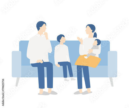 ソファで話し合う家族