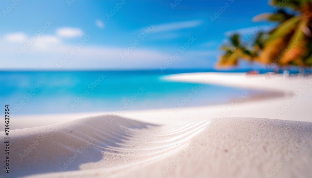 white sand curve or tropical sandy beach with blurry blue ocean and blue sky background image for nature background or summer background