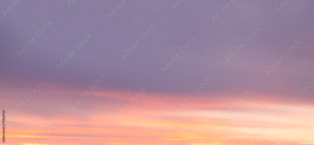 Grey and pink clouds dark sunlight sky background