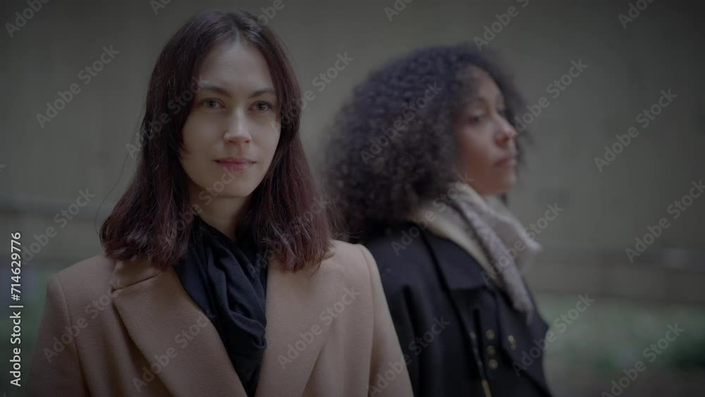 Elegant Stylish Female Models Looking at Creative Urban Architecture Exposition Elegant Stylish Female Models Looking at Creative Urban Architecture Exposition