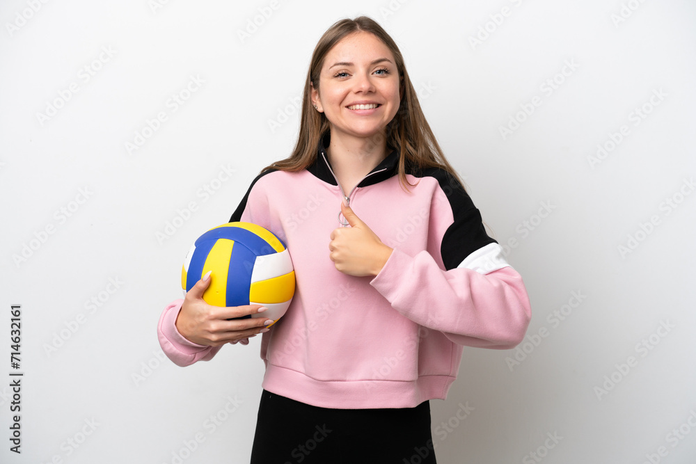 Young Lithuanian woman playing volleyball isolated on white background giving a thumbs up gesture